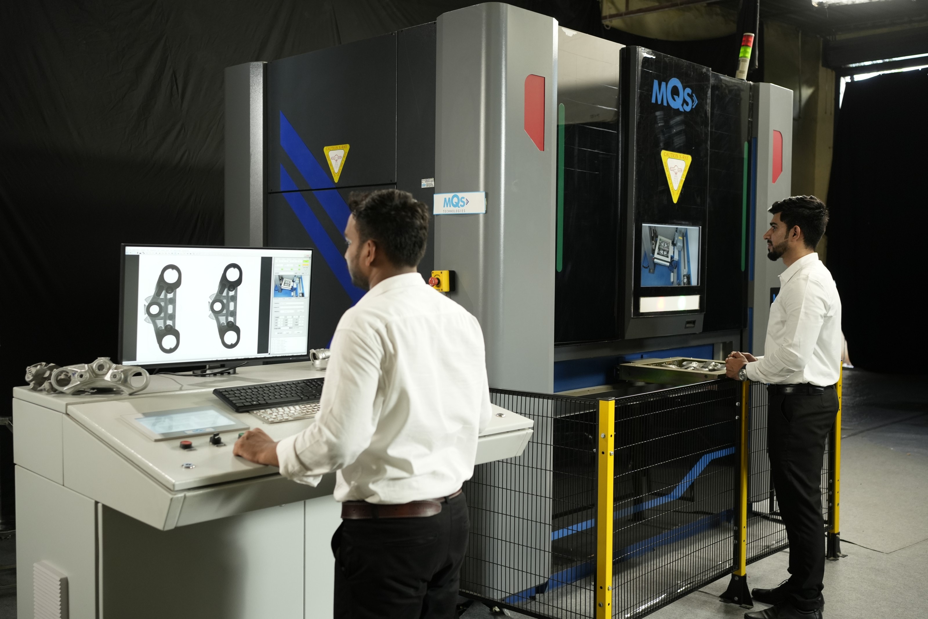 MQS engineers operating a digital radiography inspection system