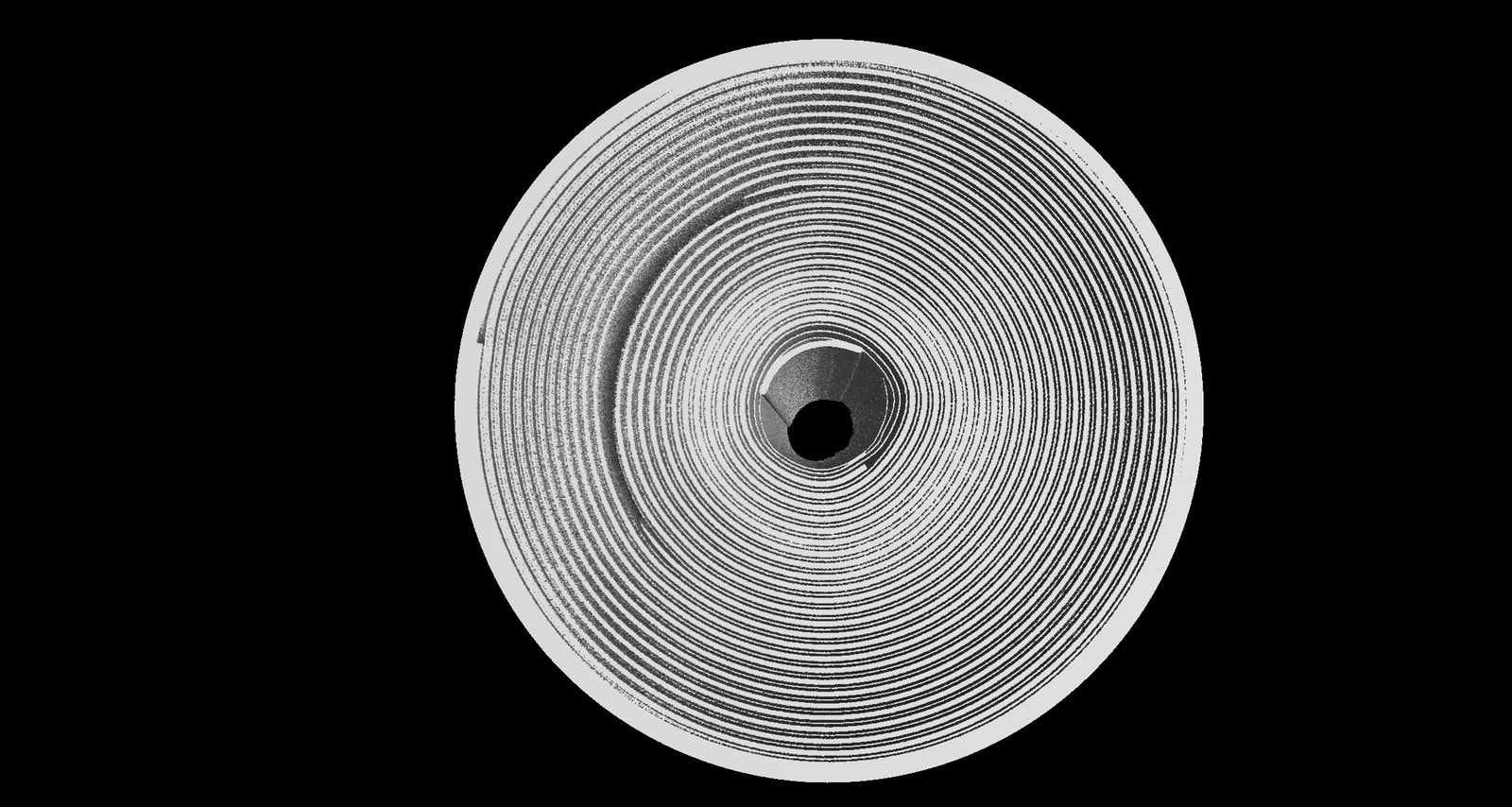 CT cross-section of a cylindrical lithium-ion battery cell showing internal winding layers