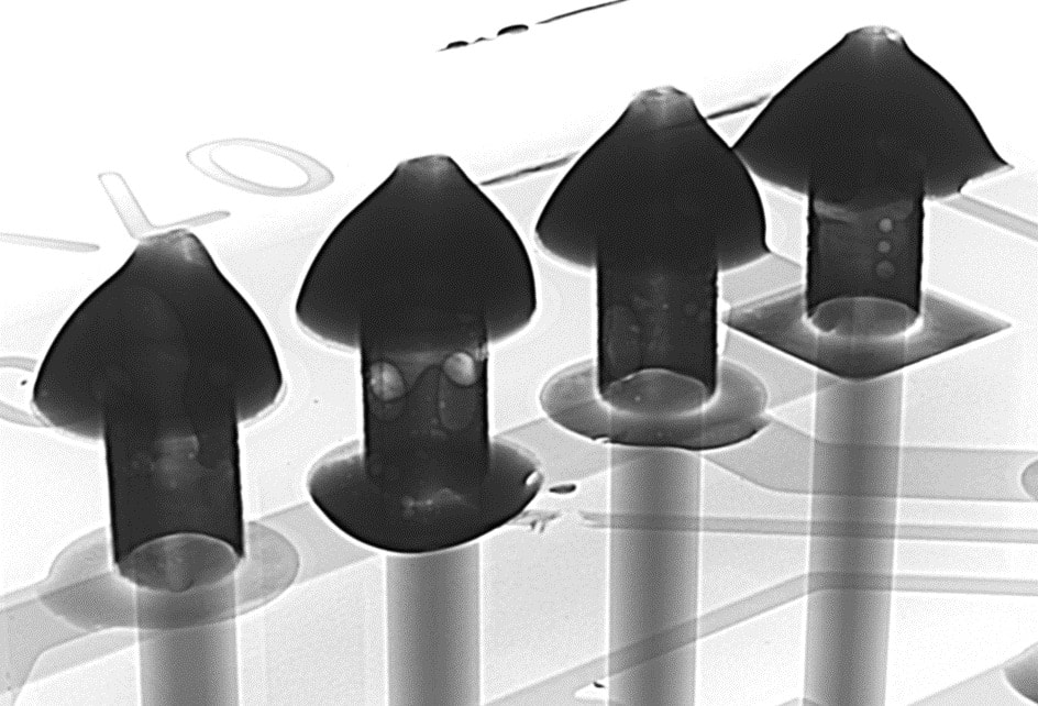 Radiograph of a plated through-hole array with voids visible in the fill
